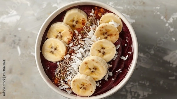 Fototapeta Colorful acai bowl with banana slices and coconut flakes vibrant superfood breakfast white backdrop overlay cut out on isolated transparent removed background