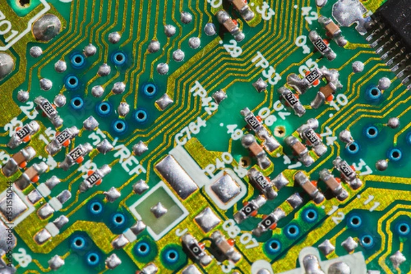 Obraz A detailed view of a green printed circuit board