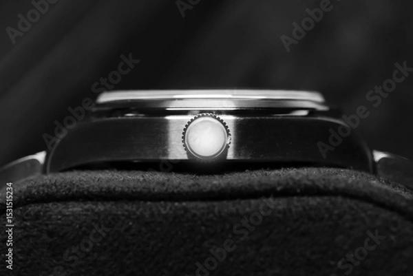 Obraz A detailed black and white view of a luxury wristwatch crown