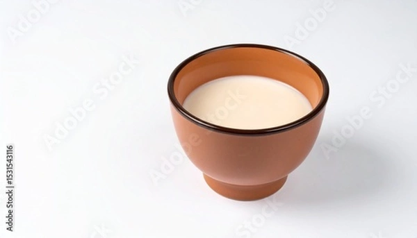 Obraz Camel Milk in Ceramic Bowl on Isolated White Background – Low-Fat Alternative with Natural Color and Studio Lighting