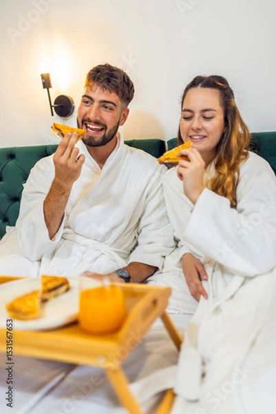 Fototapeta Couple Eating Toast in Bed