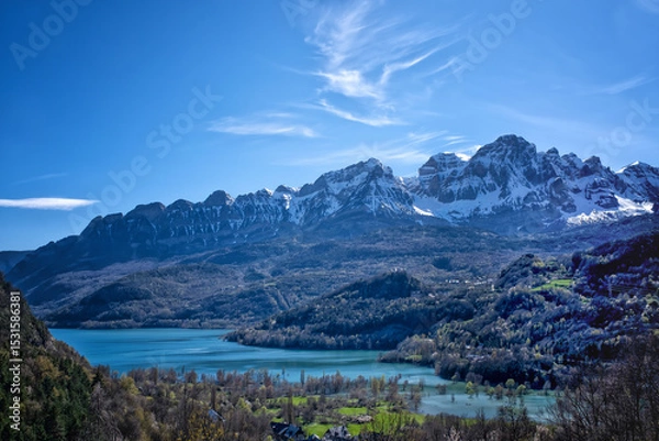 Fototapeta early spring in the Bubal reservoir, in Pueyo de Jaca with the snow-capped Pena Telera in the background, Pyrenean landscape in the Tena Valley in the Aragonese Pyrenees