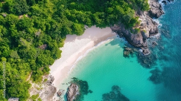 Fototapeta Aerial view of a tropical beach with lush greenery