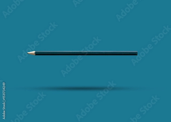 Fototapeta A dark green colored pencil isolated on a blue background, the image looks three-dimensional and the object has a shadow, template for designers.
