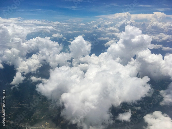 Fototapeta Aerial View of White Clouds in Blue Sky Above Earth – Scenic Atmospheric Landscape from Above
