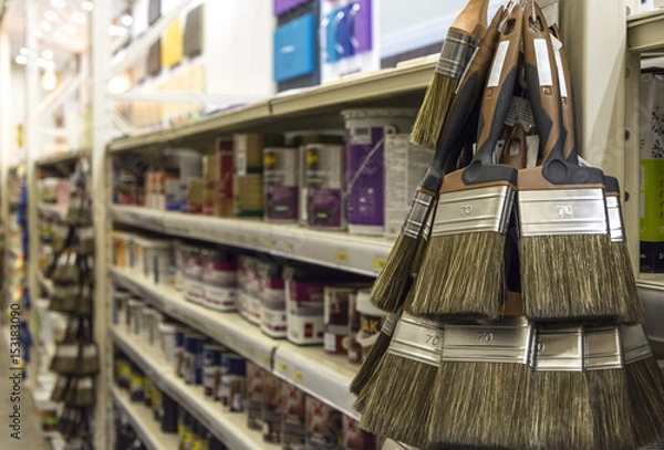 Obraz Paint brush hanging in the shop of finishing materials