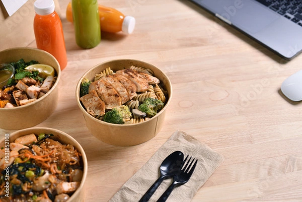 Fototapeta Having a lunch break at the office with delicious Healthy food delivery in take away boxes, Healthy eating concept.
