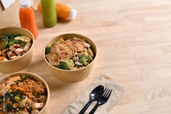 Fototapeta Having a lunch break at the office with delicious Healthy food delivery in take away boxes, Healthy eating concept.