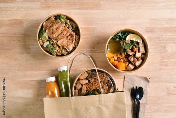 Fototapeta Having a lunch break at the office with delicious Healthy food delivery in take away boxes, Healthy eating concept.