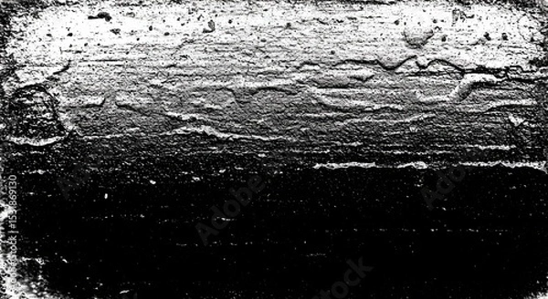 Fototapeta A black and white photo of a rocky shoreline with a dark sky