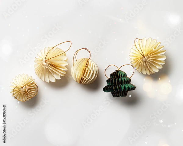 Obraz New Year decorative ornaments and green Christmas tree shape bauble on white background, Minimal layout with paper festive decor beige balls, green Christmas Tree Ornament, modern decor, top view