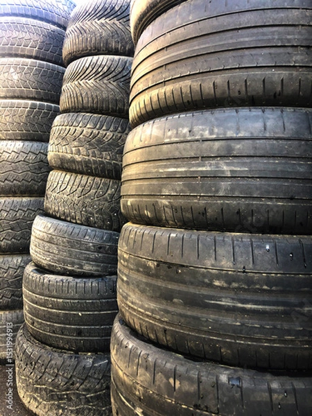 Obraz Old worn-out tires for cars. It is assembled for recycling.