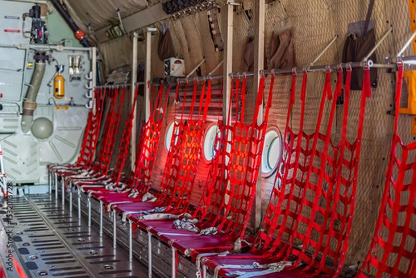 Obraz Passenger seats in military transport aircraft, military transport aircraft, and air force fighter aircraft. c130