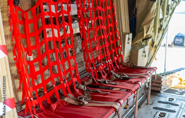 Obraz Passenger seats in military transport aircraft, military transport aircraft, and air force fighter aircraft. c130