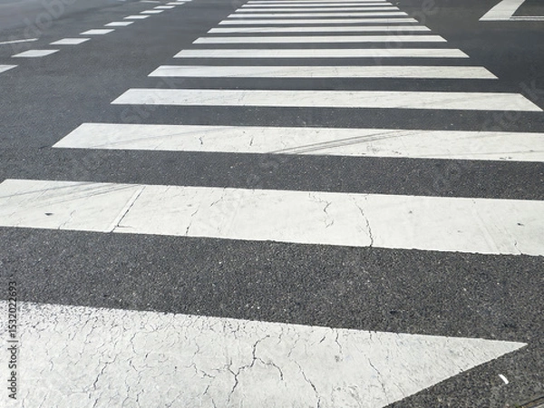 Fototapeta Empty crosswalk on asphalt road with white stripes