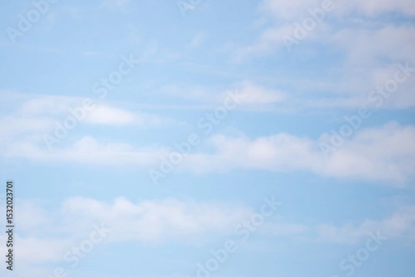 Fototapeta The sky is blue and clear with a few clouds scattered throughout