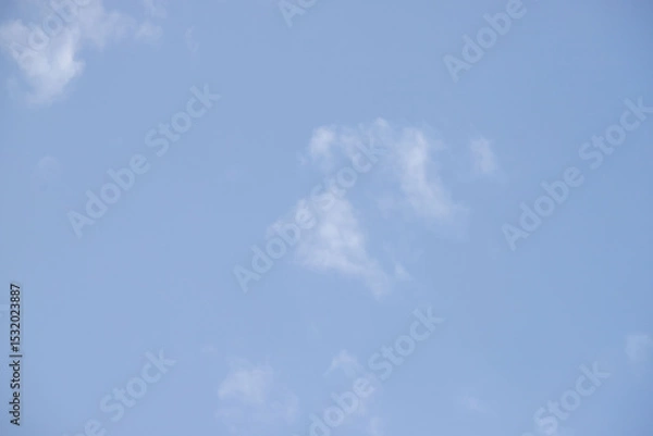 Fototapeta A clear blue sky with a few clouds