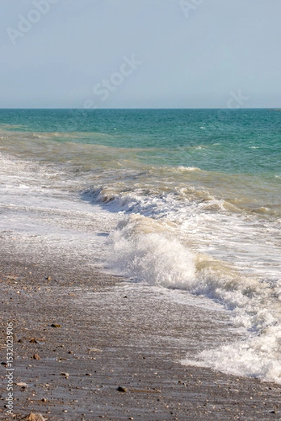 Fototapeta The ocean is calm and the waves are small