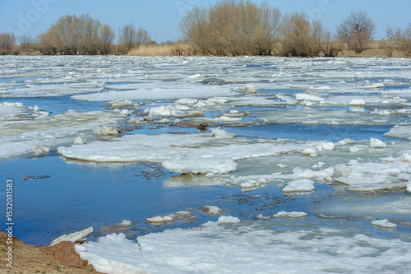 Obraz Large ice floes drifting on the Bakhthiyar River during thaw