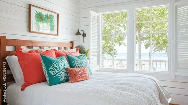 Obraz Bedroom with a large window on the right side of the room. the window has white shutters and offers a beautiful view of the ocean.