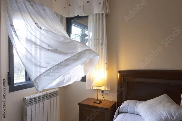 Fototapeta Breeze Blowing Through Open Window in Cozy Bedroom
