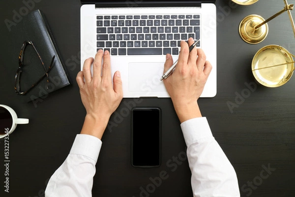 Fototapeta Lawyer Working at Desk with Laptop and Smartphone Mockup
