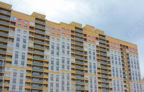 Obraz Construction of new high-rise buildings against a bright sky