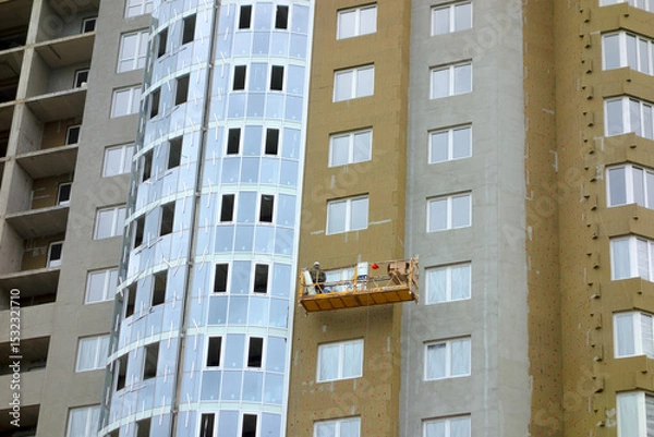 Obraz Close-up, facade finishing of a new building, construction of a new multi-storey building