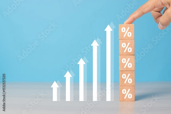 Obraz Interest rates and dividends, hand picking wooden blocks with percentage symbol and up arrow, returns on stocks and mutual funds, long term investments for retirement