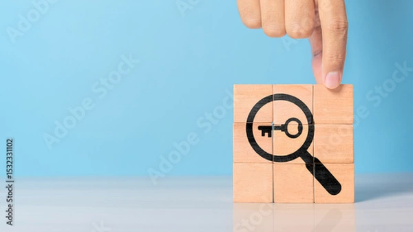 Obraz Finding solutions concept. Business problem solving and make decision. New ideas and innovation. Team brainstorming to set strategies. Hand holds wooden cubes with magnifying glass and key icon