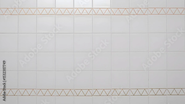 Fototapeta White ceramic wall tiles with geometric orange triangle pattern in minimalist bathroom or kitchen interior