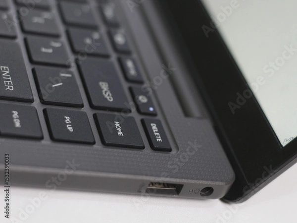 Obraz Several buttons on the laptop and USB socket.