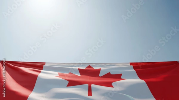 Fototapeta the Canadian flag proudly displayed against a clear, expansive blue sky, offering ample copy space for text or additional design elements