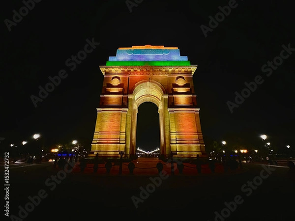 Fototapeta india gate illuminated at night with tricolor lighting showing national pride and architectural elegance of the iconic historic monument in new delhi india