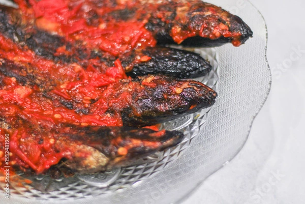 Obraz pindang or boiled fish coated in spicy chili sauce