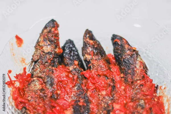 Obraz pindang or boiled fish coated in spicy chili sauce