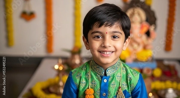 Fototapeta Indian boy wearing new clothes for Ganesha festival celebrations, joyfully posing in a festive setting with decorations