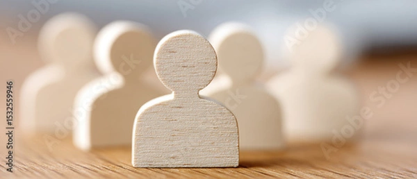 Obraz Human figures representing teamwork and collaboration on wooden table focused content type indoor environment close-up viewpoint concept of community engagement