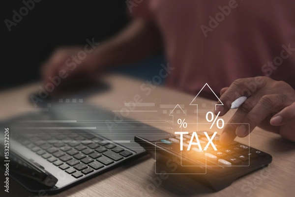 Fototapeta Calculating income for tax planning. Reviewing tax filing to ensure accuracy and compliance to reduce risks effectively. Man working with calculator and laptop in dimly lit office, Retirement planning