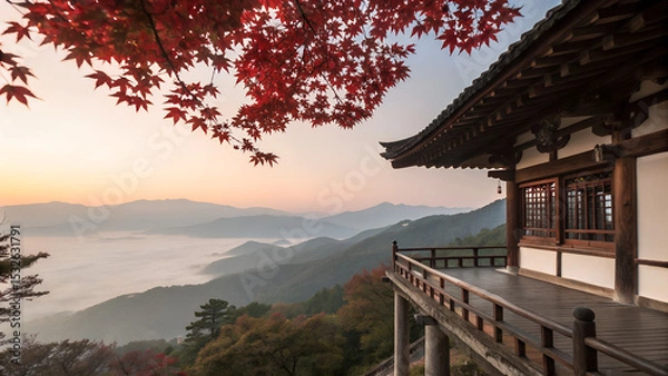 Obraz Traditional wooden terrace on the right side, overlooking a misty mountain valley at sunrise. Red maple leaves frame the top right corner, creating a serene and poetic autumn scene with soft pastel sk