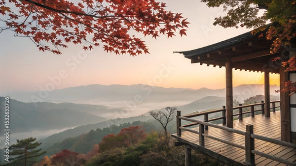 Obraz Traditional wooden terrace on the right side, overlooking a misty mountain valley at sunrise. Red maple leaves frame the top right corner, creating a serene and poetic autumn scene with soft pastel sk