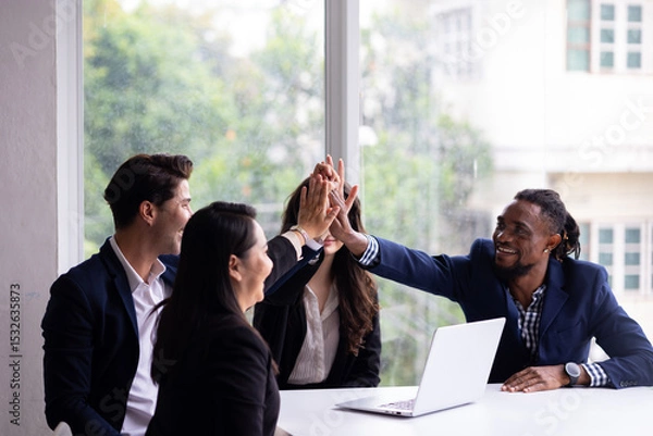Fototapeta Business team hands together : Unity and teamwork. Company employee celebrate after finishing successful project. Successful people giving each other high five in meeting