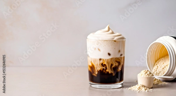 Fototapeta Iced Coffee with Cold Foam Topping, Protein Powder Scoop and Opened Jar  Standing On Surface with Empty Soft Light Colored Background 