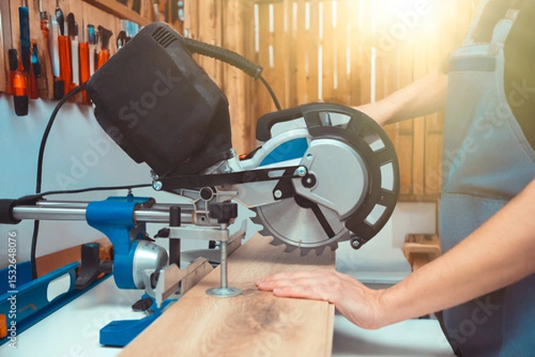 Fototapeta Miter saw while working on flooring panels