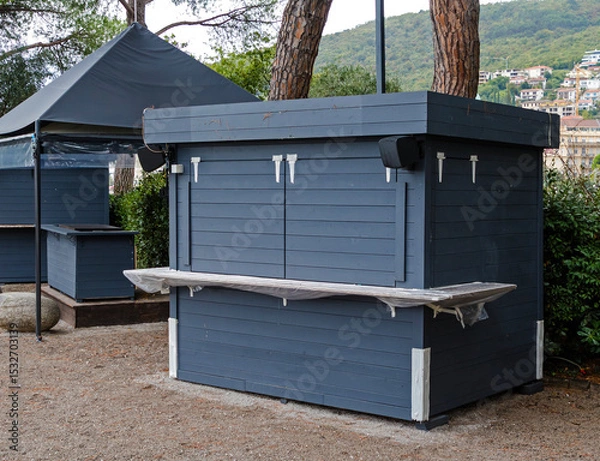 Obraz Closed wooden material kiosk inside public park
