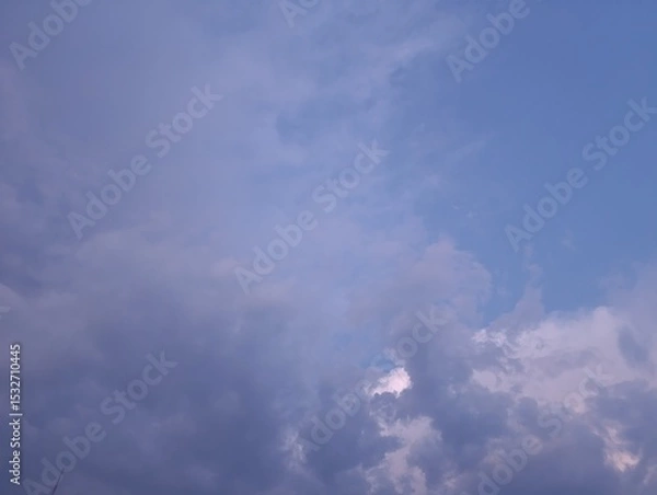 Fototapeta Clouds in the sky before the rain at sunset. Evening sky before the rain