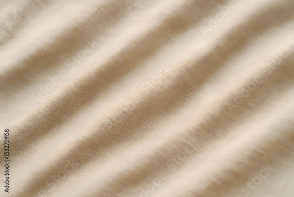Fototapeta Detailed view of soft, neutral-colored fabric with visible threads and gentle waves forming across the surface..