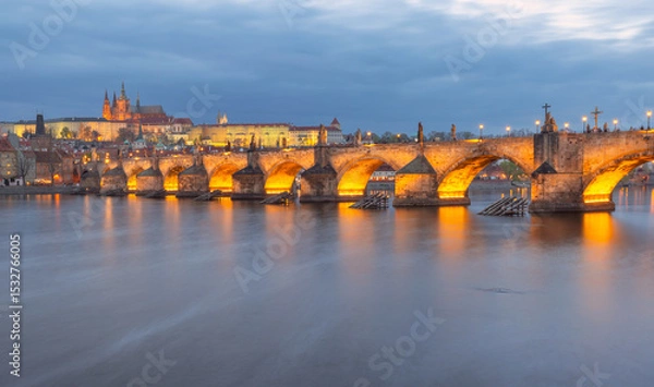 Fototapeta Illuminated Charles Bridge in Prague Czech Republic seen at dusk over the Vltava River