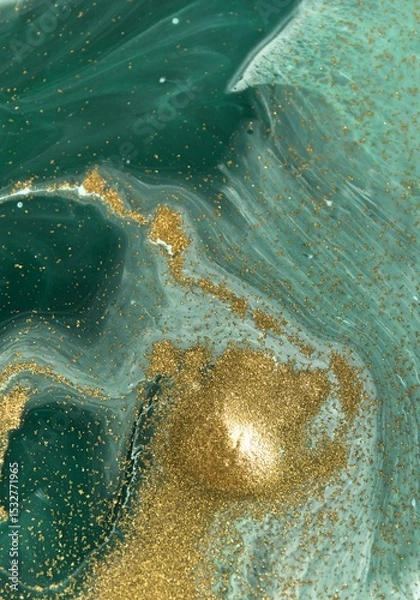 Fototapeta Abstract art featuring swirling teal and gold pigments in a fluid design