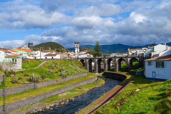Fototapeta Landscape with river and arch bridge in Ribeira Grande, Sao Miguel, Azores, Portugal.